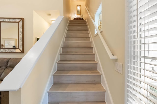 stairway featuring plenty of natural light