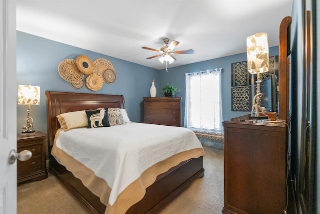 bedroom with ceiling fan and light colored carpet