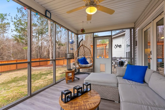 sunroom / solarium with ceiling fan