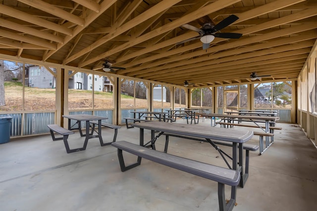 view of community featuring outdoor dining area and a patio area