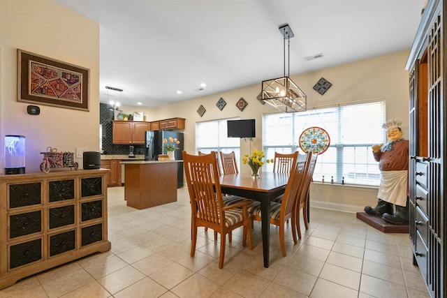 dining space featuring light tile patterned floors, recessed lighting, visible vents, a chandelier, and baseboards