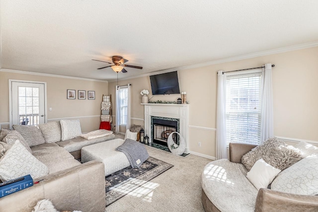 carpeted living room with plenty of natural light and crown molding