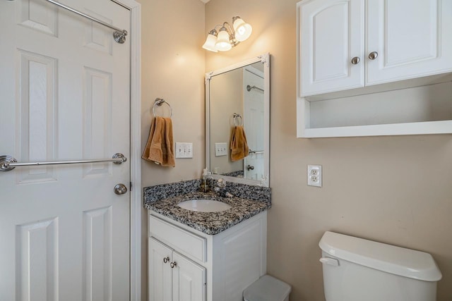 bathroom with toilet and vanity