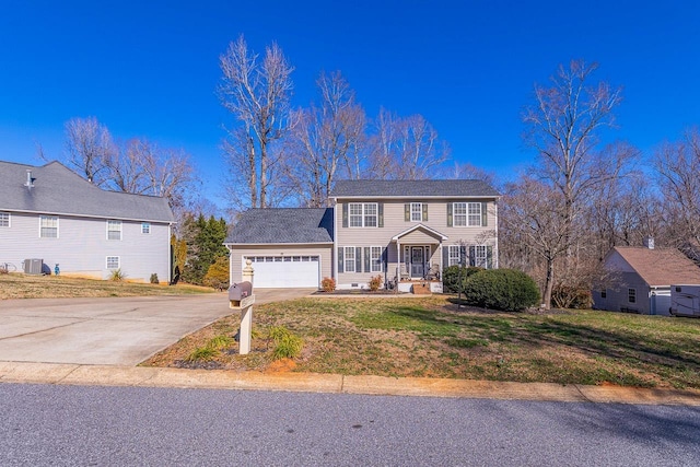 colonial-style house featuring driveway, a front lawn, an attached garage, and cooling unit