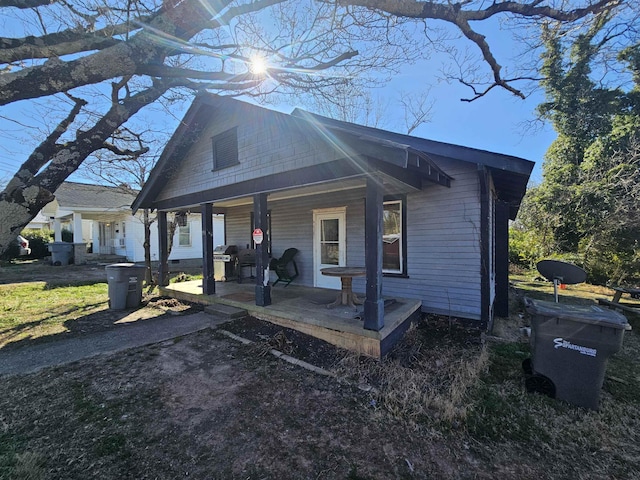 view of front facade with crawl space and a porch