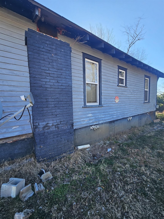 view of side of property featuring crawl space