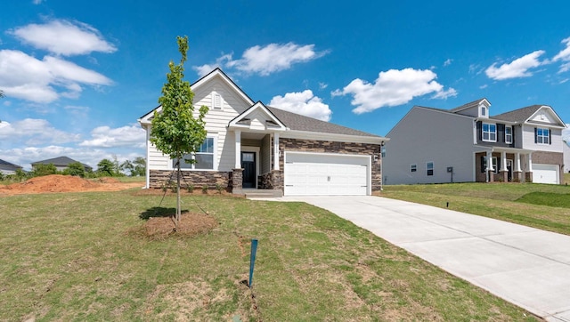view of front of home featuring stone siding, concrete driveway, a garage, and a front lawn