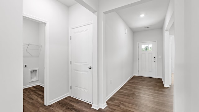hall featuring dark wood finished floors and baseboards