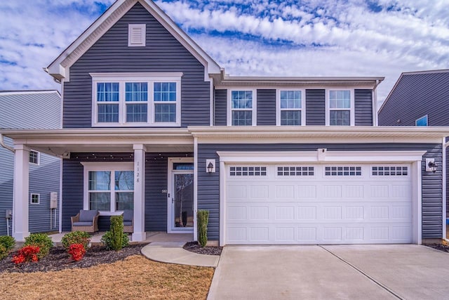 view of front of home featuring a garage and driveway