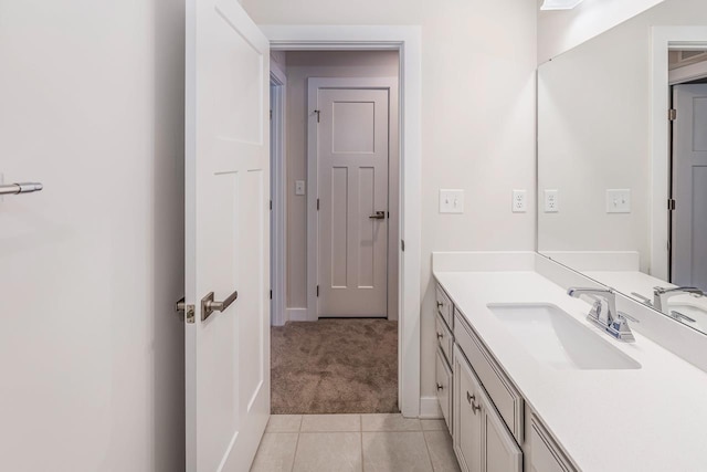 bathroom with tile patterned flooring and vanity