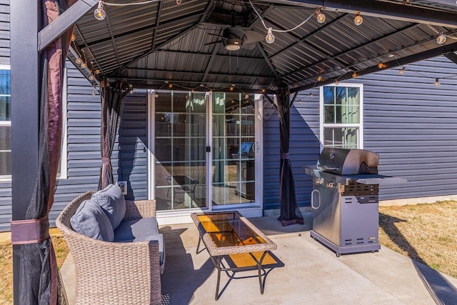 view of patio with grilling area, a gazebo, and an outdoor hangout area