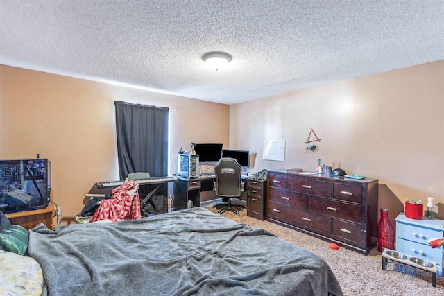 bedroom featuring a textured ceiling and light colored carpet