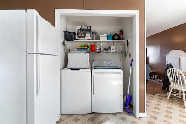 washroom featuring laundry area and washer and clothes dryer