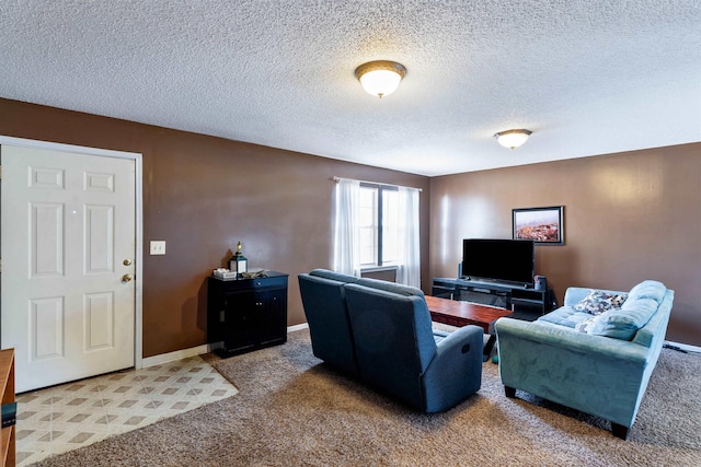 living room with a textured ceiling, carpet, and baseboards