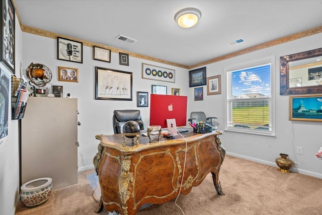 carpeted office space with visible vents and baseboards