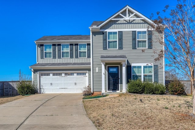 view of front facade with a garage, concrete driveway, board and batten siding, and fence