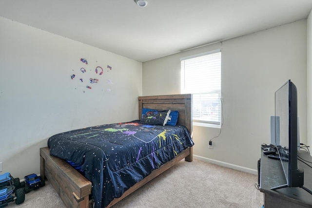 carpeted bedroom with baseboards