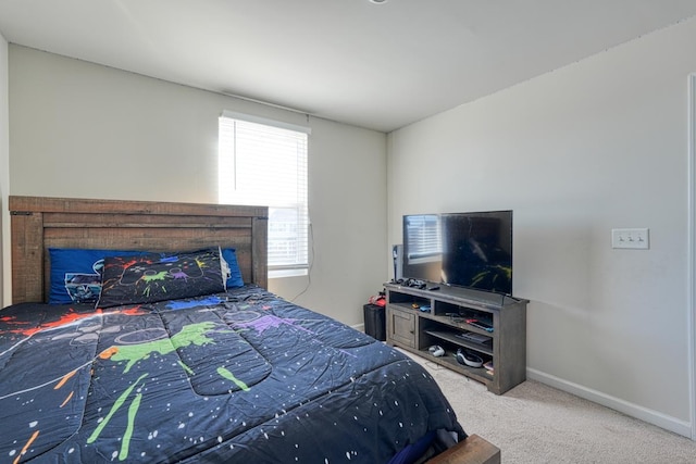 bedroom featuring baseboards and carpet flooring