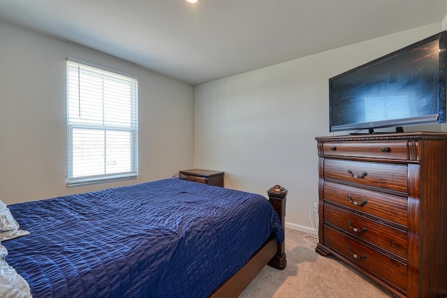 bedroom with carpet and baseboards