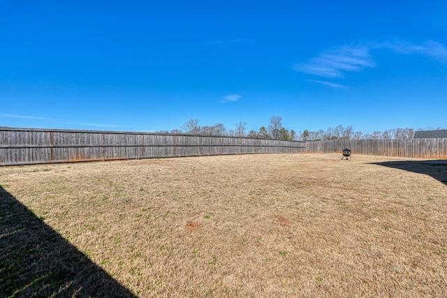 view of yard featuring a fenced backyard