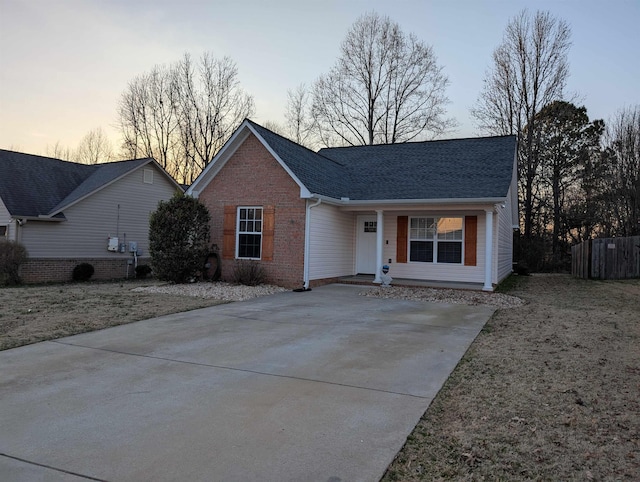 single story home with brick siding and roof with shingles