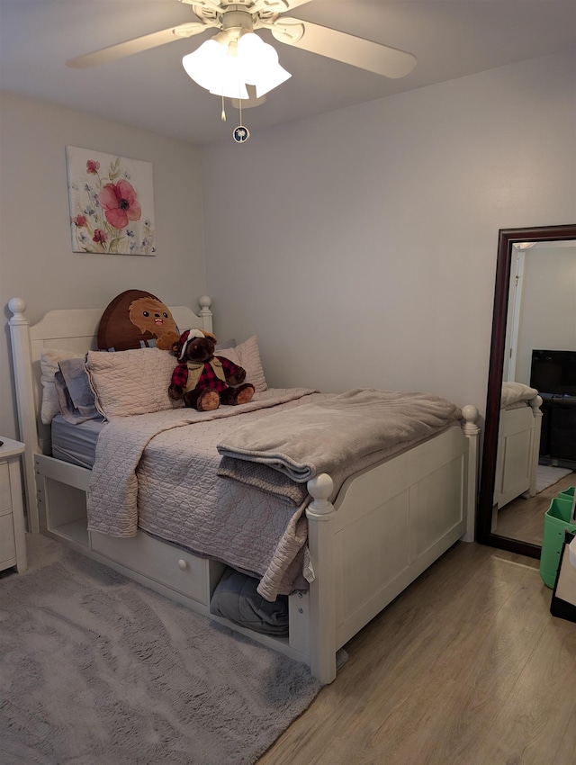 bedroom featuring ceiling fan and light wood finished floors