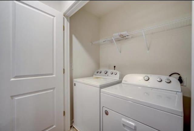 laundry room featuring laundry area and washing machine and clothes dryer