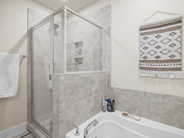 full bathroom with a garden tub and a shower stall