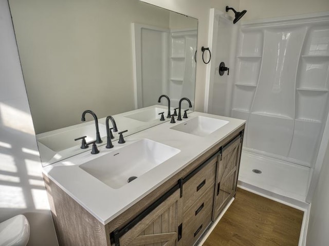 full bathroom featuring a sink and walk in shower