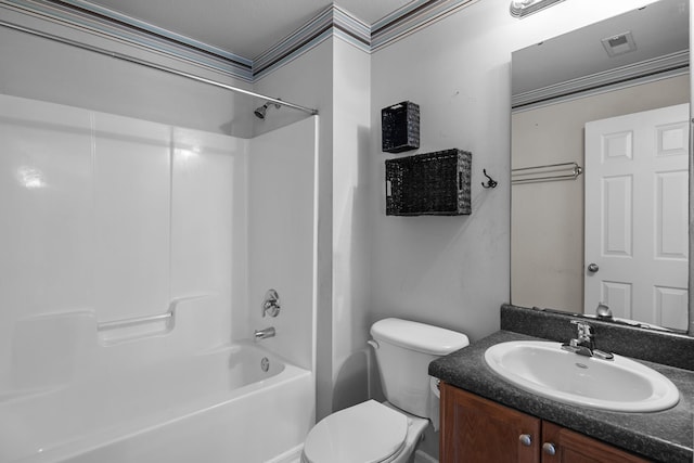 bathroom with visible vents, washtub / shower combination, vanity, and toilet