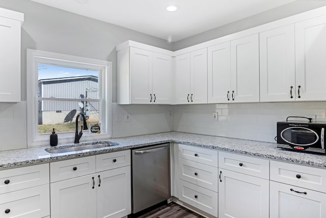 340 W Peachtree, Woodruff, SC 29388 - kitchen with dishwasher, a sink, white cabinetry, and decorative backsplash