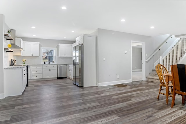 340 W Peachtree, Woodruff, SC 29388 - kitchen featuring wall chimney range hood, stainless steel appliances, dark wood-style flooring, and recessed lighting
