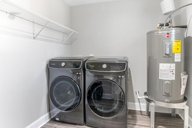 340 W Peachtree, Woodruff, SC 29388 - washroom featuring electric water heater, wood finished floors, laundry area, independent washer and dryer, and baseboards