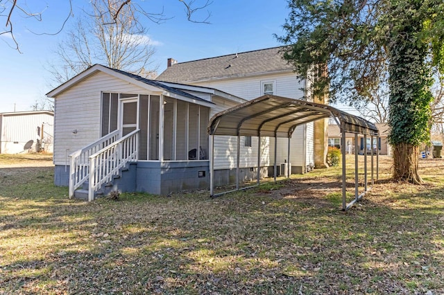 340 W Peachtree, Woodruff, SC 29388 - rear view of house with a yard, roof with shingles, crawl space, a detached carport, and a chimney