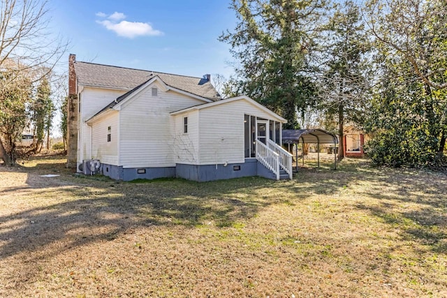 340 W Peachtree, Woodruff, SC 29388 - view of property exterior with a detached carport, crawl space, a lawn, and entry steps
