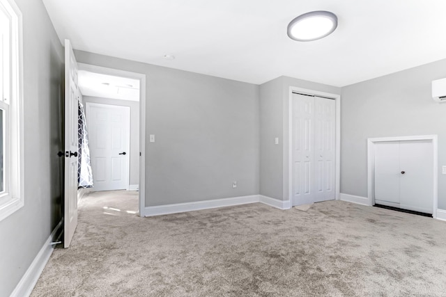 340 W Peachtree, Woodruff, SC 29388 - unfurnished bedroom with a closet, a wall unit AC, carpet flooring, and baseboards
