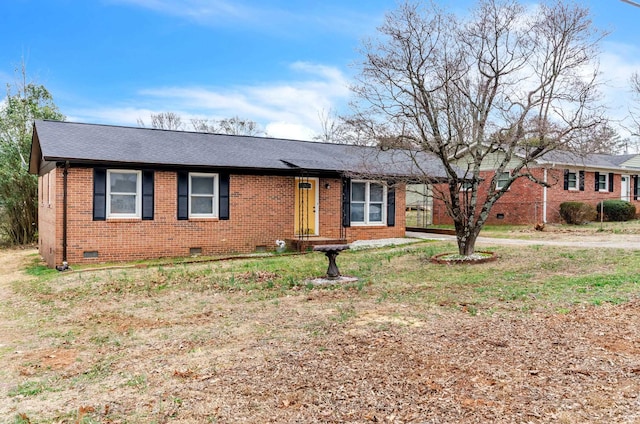 single story home with crawl space, roof with shingles, and brick siding