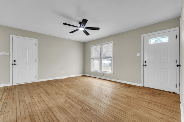 foyer featuring light wood-style flooring, baseboards, and a ceiling fan