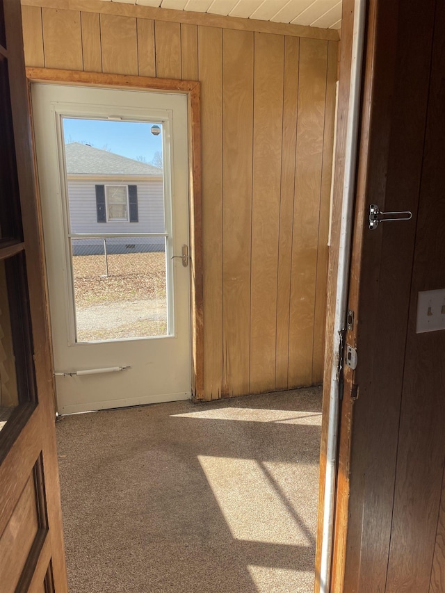 doorway featuring wooden walls