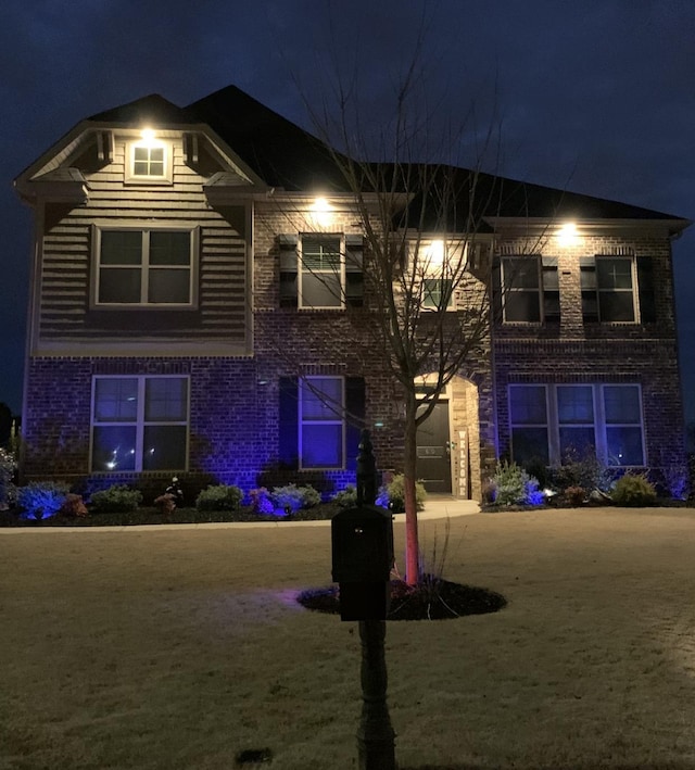 view of front facade featuring brick siding