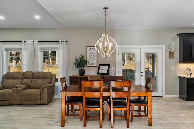 dining room with light wood-style flooring, a notable chandelier, recessed lighting, baseboards, and french doors