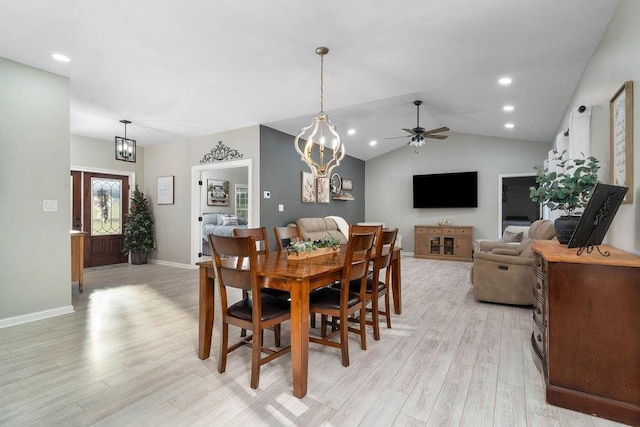 dining space featuring recessed lighting, baseboards, vaulted ceiling, light wood-type flooring, and ceiling fan with notable chandelier