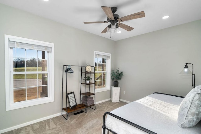 carpeted bedroom with baseboards, a ceiling fan, and recessed lighting