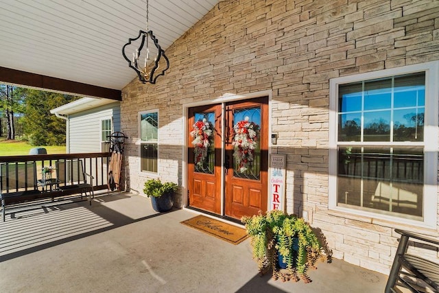 doorway to property featuring stone siding