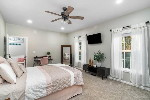 carpeted bedroom featuring a ceiling fan and recessed lighting