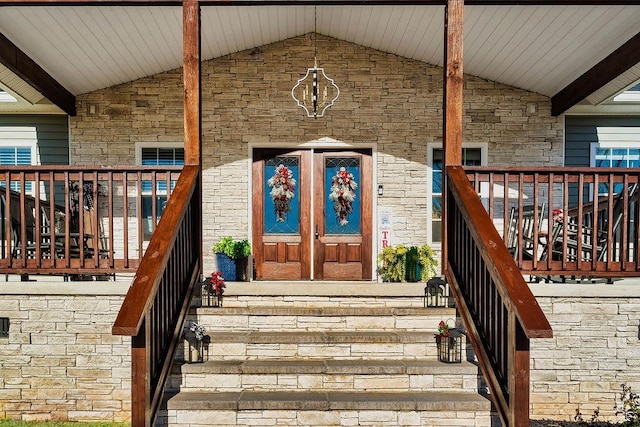 doorway to property featuring covered porch