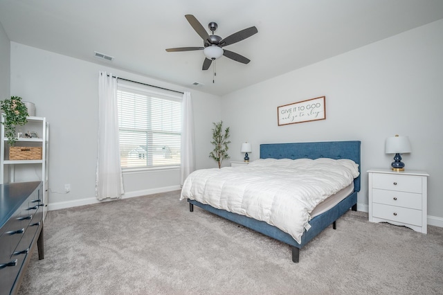 bedroom featuring a ceiling fan, carpet flooring, visible vents, and baseboards