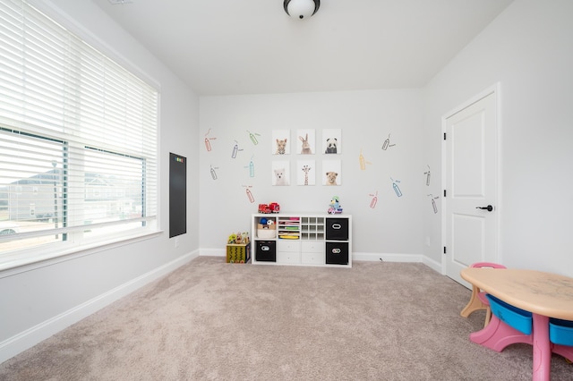 rec room featuring carpet and baseboards