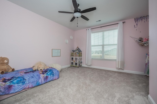 bedroom featuring ceiling fan, carpet floors, visible vents, and baseboards