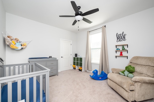 carpeted bedroom featuring a ceiling fan